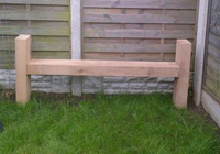 Simple outdoor garden seat with sides made from sleepers